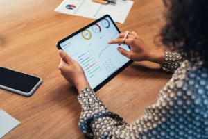 A woman with a tablet analyzing